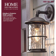Hargreaves 13.5 in. 1-Light Gilded Iron Rustic Farmhouse Hardwired Outdoor Wall Light Lantern Sconce with Seeded Glass