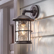 Hargreaves 13.5 in. 1-Light Gilded Iron Rustic Farmhouse Hardwired Outdoor Wall Light Lantern Sconce with Seeded Glass