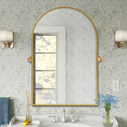 24 in. W x 32 in. H Arched Metal Framed Pivoted Bathroom Wall Vanity Mirror in Gold